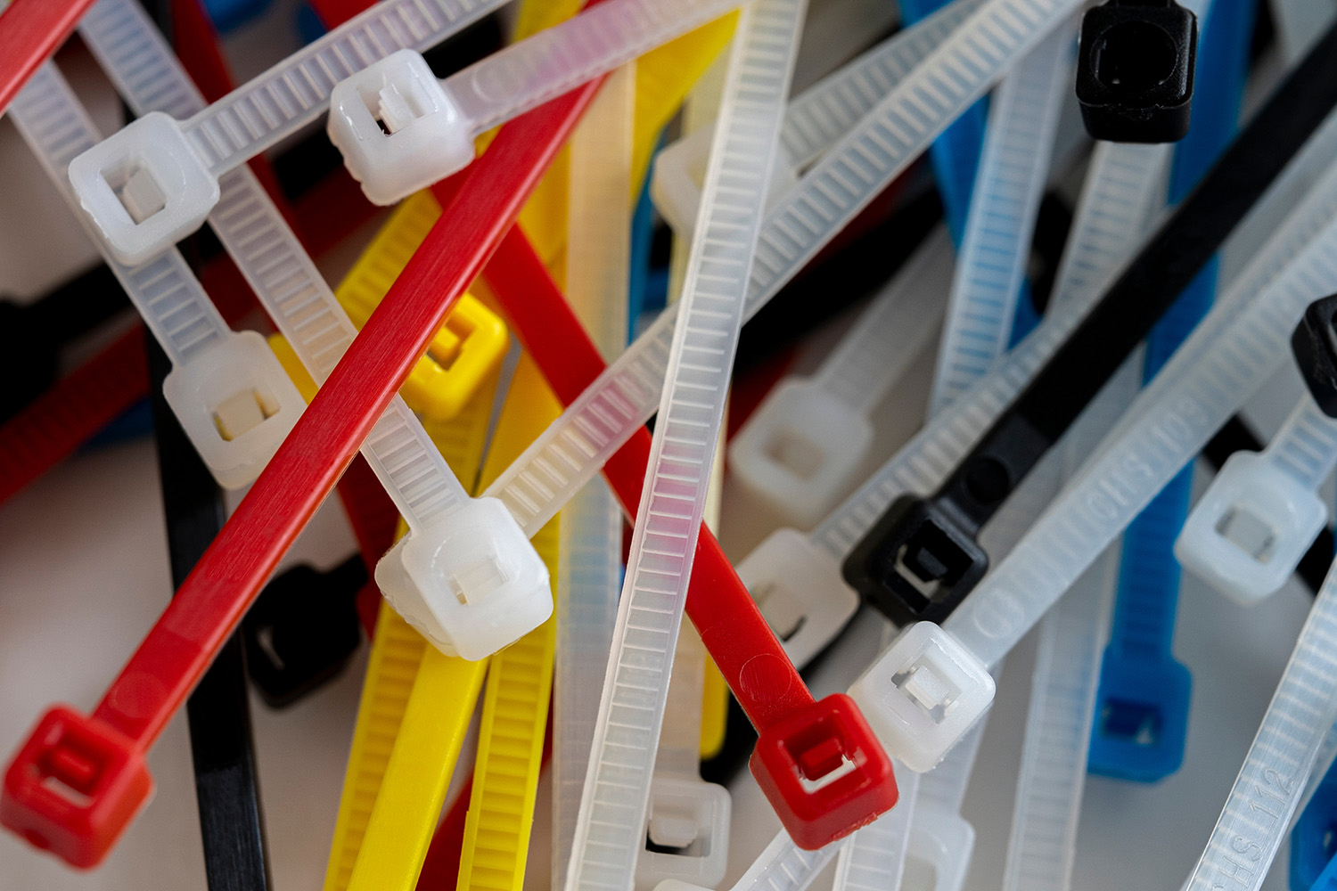 Multicolored zip ties in a pile.